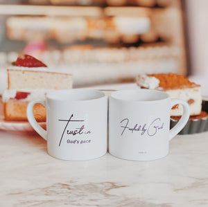 Christian Home Lookbook: Pair of small Christian gifts, white ceramic Fueled by God and Trust in God’s Pace Christian Mugs